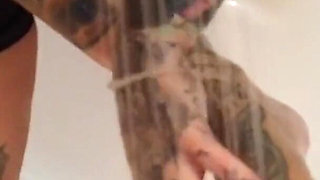 Tattooed blonde MILF washes her feet