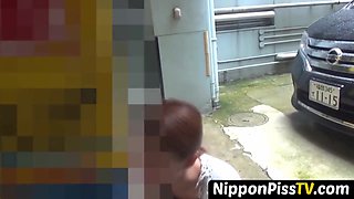 NipponPissTV.com - Nerdy Asian cocktease kneels for pissing behind tree outdoors