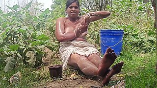 South Indian bhabhi Somausha enjoys a splash outside in the village