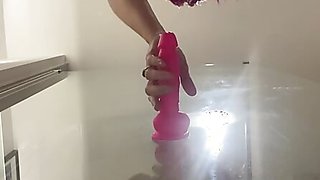 50+ in the Bathroom with her toys