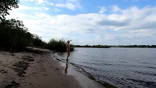 Exhibitionist Blonde Goes Nude on a River Beach