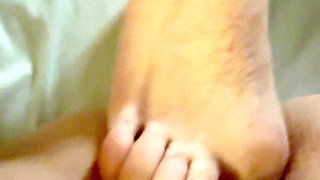 A Guy Does a Footjob for Me