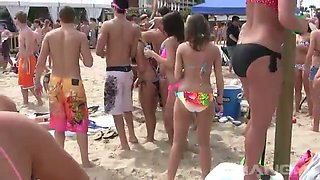 Horny chicks in sexy bikinis getting wild with each other on the beach