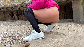 Stepmom on the Beach Pees and Shows Her Ass