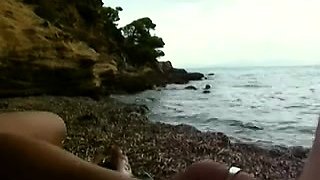 Busty amateur wife delivers a great handjob on the beach