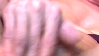 Mature in red heels masturbates in a close-up video with her sex toys