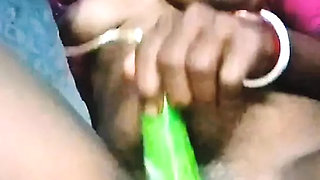 Asian house wife self satisfaction with brinjal and her pussy orgasm squirting her with brinjal