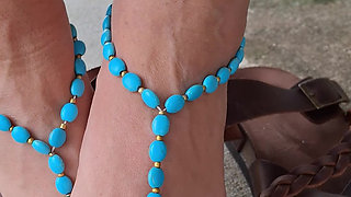 Showing off her soles and cute barefoot sandals
