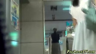 asian lady pees in toilet
