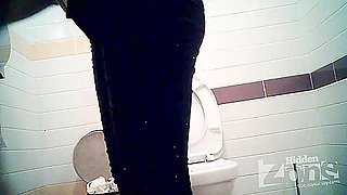 Busty MILF pissing in the toilet on the