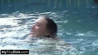 A Horny Brunette by the Pool Is Sucking off His Small Cock