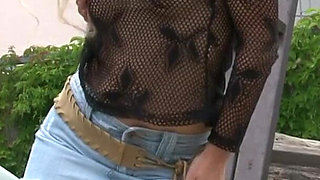 Stunning blonde MILF at outdoors photo shooting