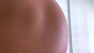 Hot babe with perfect big boobs taking shower