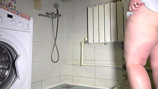 Morning pissing at home. Hairy pussy urinates over the toilet or in the shower doggy style. Fetish from chubby milf with big ass