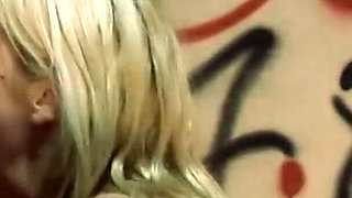Kelly Wells is getting fucked while sampling cock from multiple glory holes