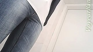 Cute brunette white girl flashes her ass in the toilet