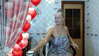 Red-hot housewife Lukerya struts in black lingerie while cooking in the kitchen