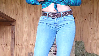 Petite cowgirl strips in barn showing off naked body
