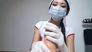 ASIAN NURSE GIVES DILDO HANDJOB WITH SURGICAL MASK AND GLOVES
