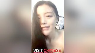 Skinny Chinese camgirl fucks in maid outfit