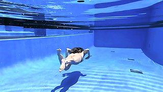 Beautiful brunette milf Cory Chase solo set in the pool.