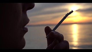 Smoking Cigarettes on the Beach... at Day and in Sunset.