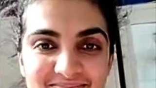 Busty indian milf strips nude to show round tits on webcam