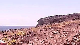 Couple Is Hiking Naked Near the Coast
