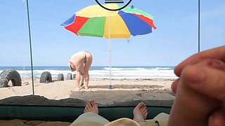 matured tourists have extreme outdoor handsjob on the beach.