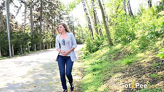Cute amateur college girl in the park pulls down her jeans