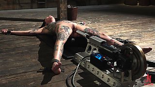 slender tattooed nympho gets railed by a dom stud's machine