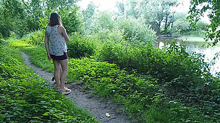 Two girls stopped on the side of the road to pee, attracting the attention of passing cars, golden shower in a public place