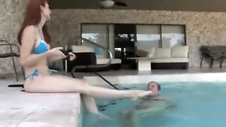 mistress using slave in swimming pool