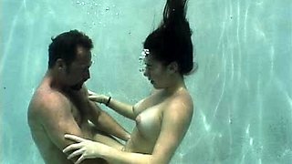 Amazing busty brunette slut doing blowjob outdoor