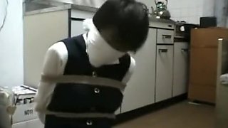 School girl tied up and gagged in kitchen