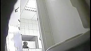 A juicy brunette caught by a pissing in a public toilet