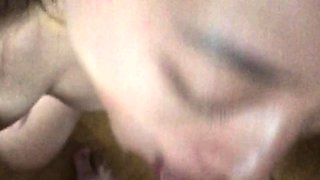 Asian bimbo sucks on a big cock close up