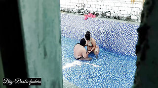 A neighboring couple was seen secretly having sex in the swimming pool.