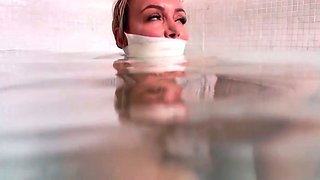 Bound and gagged MILF slave banged hard in the hot tub