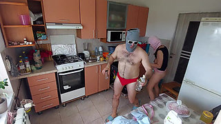 Amateur couple having fun in the kitchen.