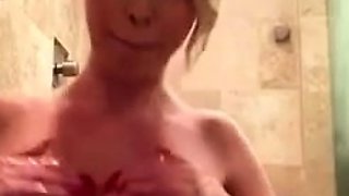 Hot babe with perfect big boobs taking shower
