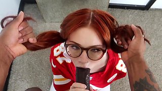 Cute nerdy redhead sucks a giant black cock and swallows it all the way to the base