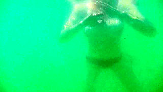 My tits underwater on public beach