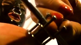 Slave M nipple stretching