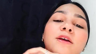 Sensual Brunette Puts Oil All Over Her Body