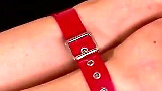 Bound Beauty in Red Straps Teased on Red Bed