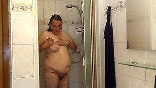 Chubby mature woman in the shower - soft belly - part 2