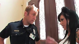 Tattooed dark-haired gives a bj to a cop