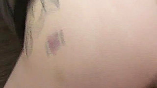 Tattooed Brunette Gets Fingered on the Couch and Cums Hard