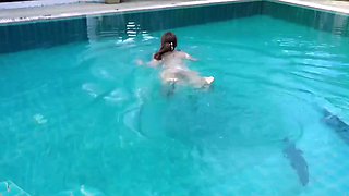 Hot brunette girl with nice big ass enjoys getting her pussy fucked in an outdoor swimming pool